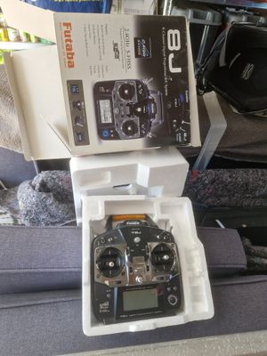 a box with a remote control in it sitting on a couch