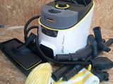 a vacuum that is sitting on the floor next to some cleaning supplies