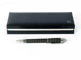 the pen is sitting next to a black box with a pen in it