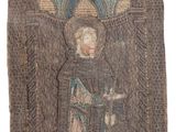 a close up of a tapestry with an image of a man in a robe