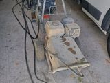 a truck that is parked in a garage with a machine