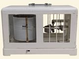 a small machine that is sitting inside of a cage