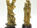 paire de figurines chinoises en ivoire sculpté représentant une femme et un homme