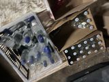 many bottles of water in a box on the floor