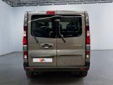 a grey van that is parked in a room