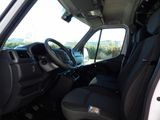 a view of the inside of a truck from the driver ' s seat