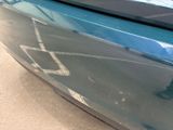 a close up of a car ' s bumper with a sticker on it