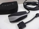 a black box with a charger and a cord attached to it