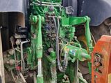 a tractor that is parked on the side of the road