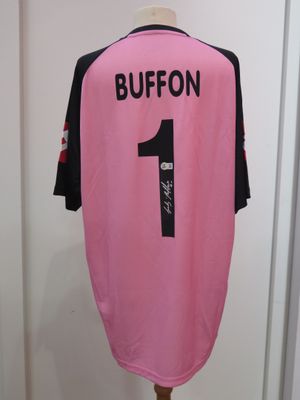 the shirt is pink and black with a number one on it