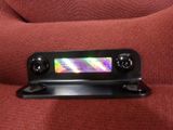 a close up picture of a remote control on a couch
