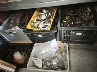 many different types of metal items in the bins