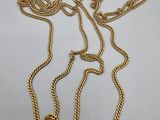 a gold chain with a knot on it