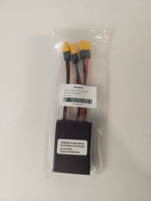 a close up of two wires in a plastic bag on a white surface