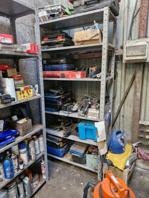 a garage with a lot of tools on the shelves