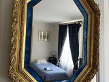 a mirror that is hanging on the wall in the room