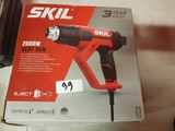 the box of a drill is sitting on the table