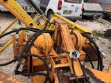 a yellow bulldozer that is sitting in the dirt