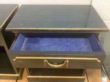 pair of black and gold nightstands with blue velvet drawer