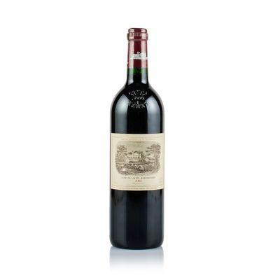 a close up of a bottle of red wine on a white surface