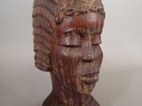 wooden sculpture of a woman ' s head on a white background