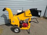 a small yellow machine that is sitting on the ground