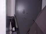 an umbrella that is leaning against a wall in a room