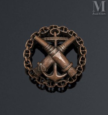 an image of a brooch with a cross and anchor on it