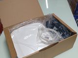 a box with a white shirt inside of it on a table