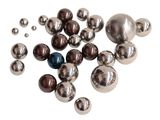a pile of metal balls on a white surface