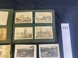 an old photo of a collection of old photographs on a table