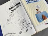 an open book with a drawing of a man and a woman