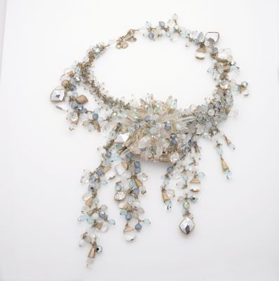 an image of a necklace made out of glass beads on a white surface