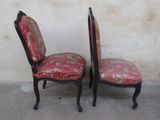 two chairs that are sitting next to each other