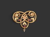 une image représentant une broche en or ornée de fleurs et de feuilles