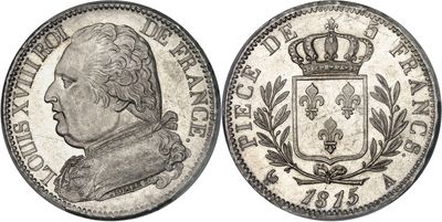 a silver coin with a crown on top of it