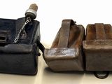 four pieces of luggage sitting next to each other on a table