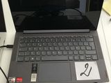 a laptop computer sitting on top of a desk with a mouse and headphones
