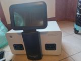 a small tv sitting on top of a box on the floor