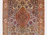 un ancien tapis persan à motif de médaillon