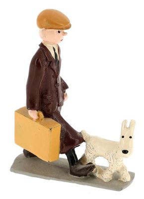 figurine of a man with a suitcase and a dog