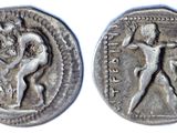 a silver coin with a man and a woman on it