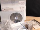 a box with a cd sitting on top of a wooden table