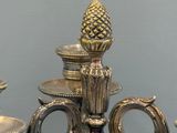a silver candelab with a pineapple on it