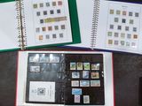 a lot of stamps on the pages of a binder