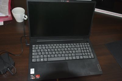 a laptop computer sitting on a desk next to a mouse
