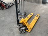 a fork lifter that is sitting in a garage