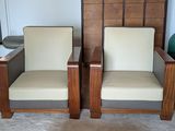 two chairs sitting next to each other in a living room
