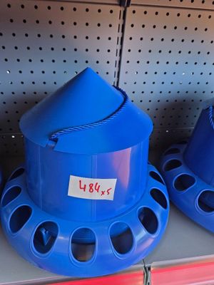three blue hats on a shelf in a store