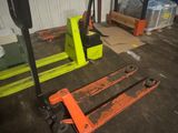 two forklifts sitting next to each other in a warehouse